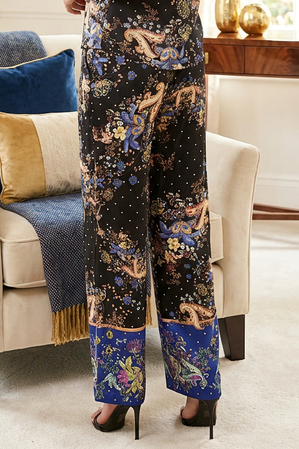 Back view of wide-leg printed pant showing smooth waistband and drape.