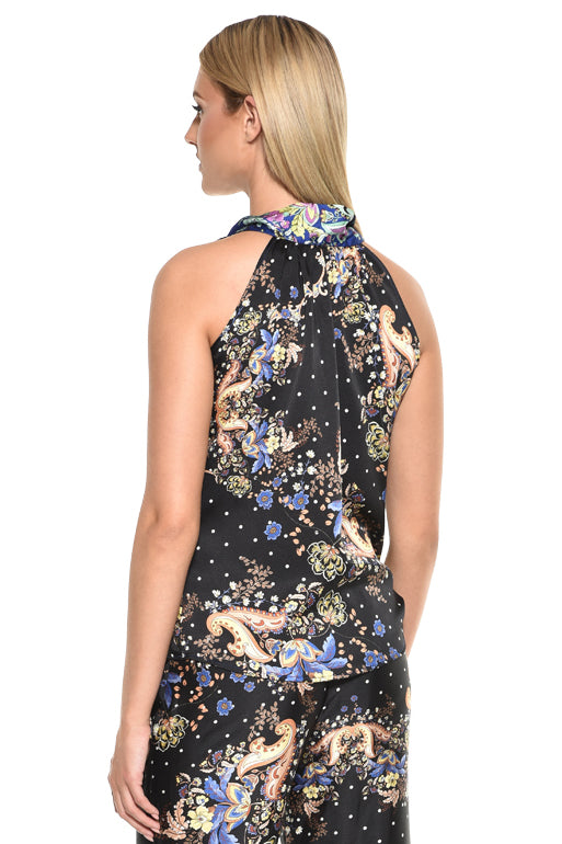 Echo print sleeveless top styled for a resort dinner look.