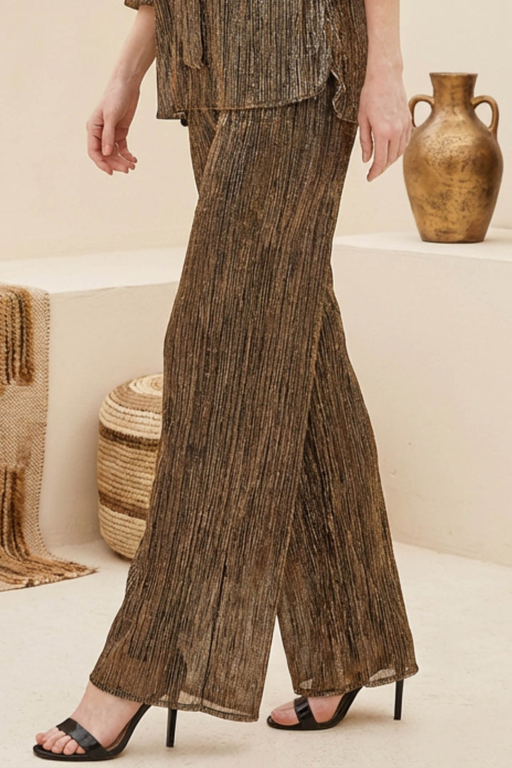 Edi Pant in motion with flowing, straight-leg silhouette for parties.