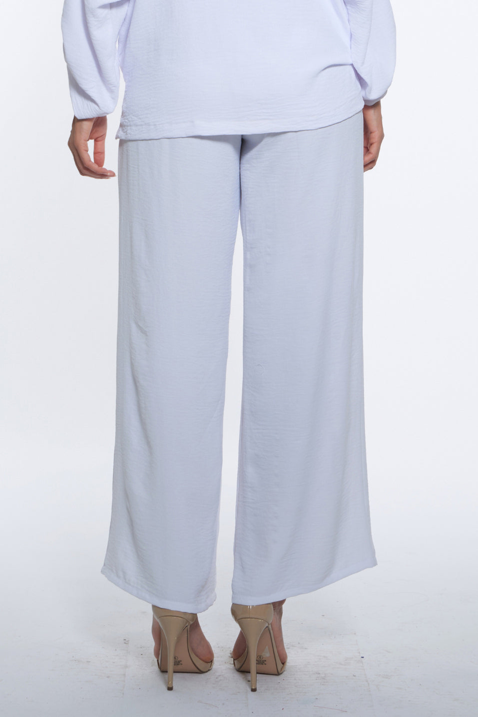 Kore Pant – White with fluid wide-leg movement.