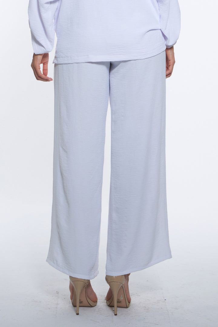 Kore Pant – White with fluid wide-leg movement.