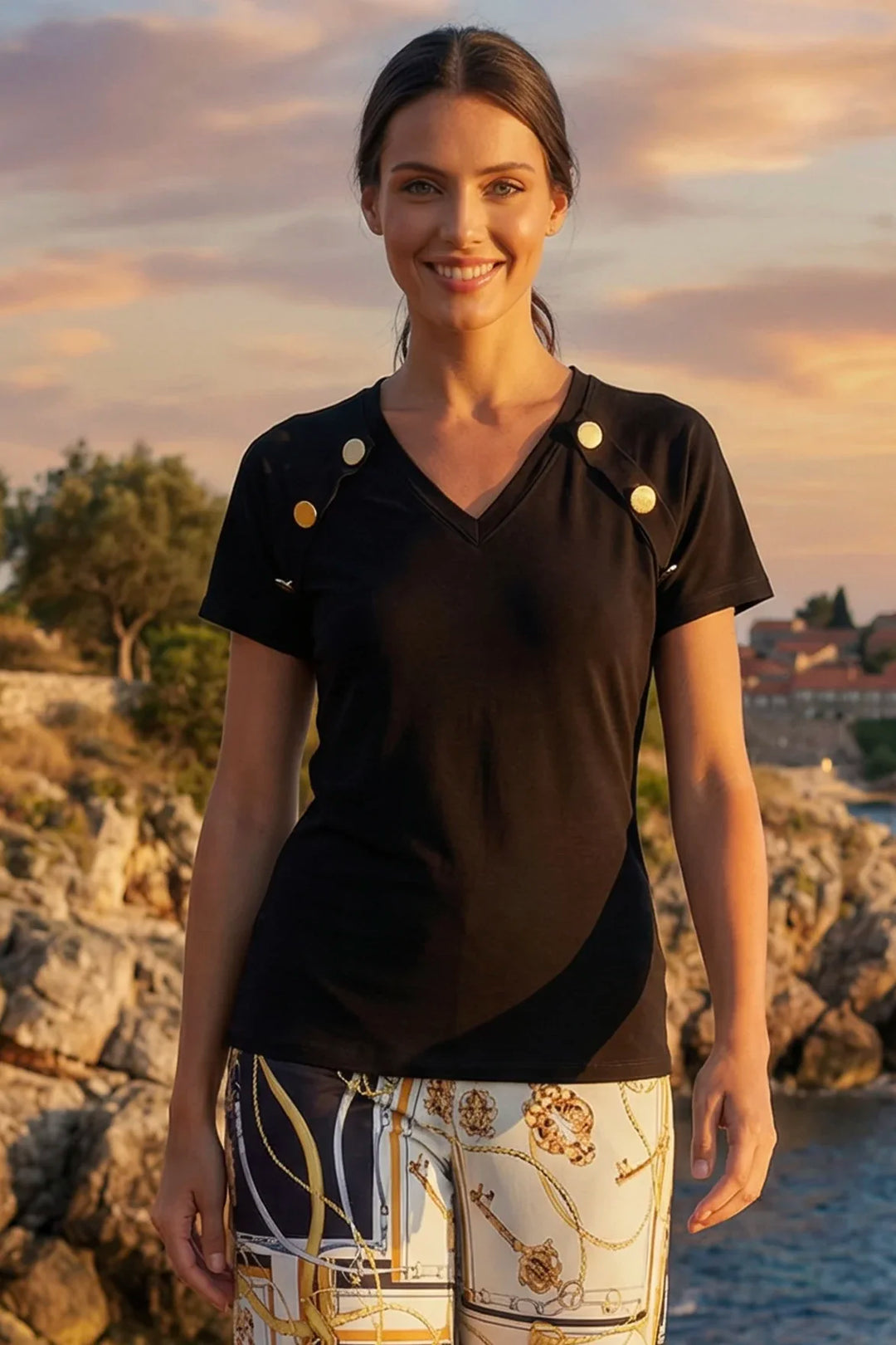 Tere Top black v-neck short sleeve with gold button detail front view.