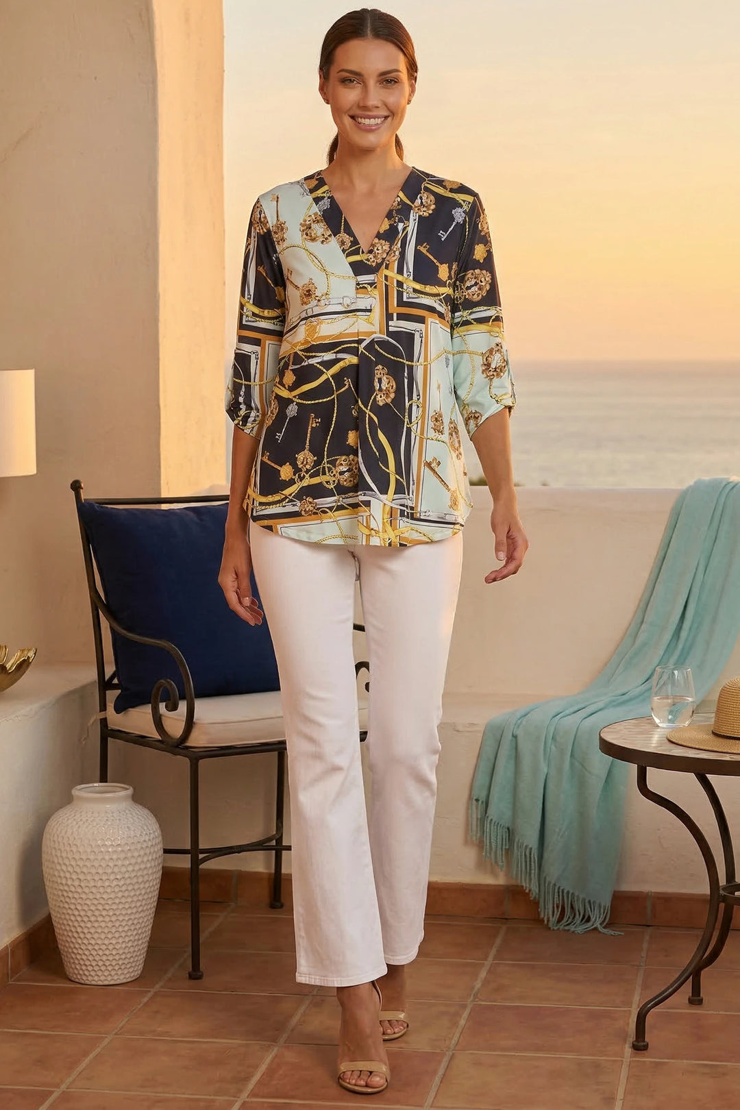Nova Top styled with white pants for resort daytime and night look lifestyle front view