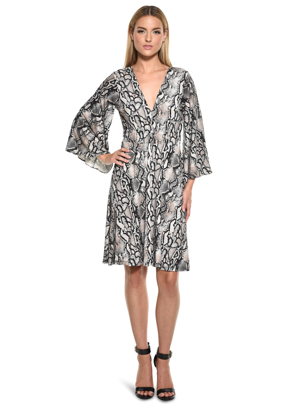 Model wearing Julian Chang Frank Dress in Snake Print with deep V-neckline and three-quarter bell sleeves